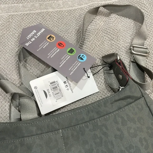 Baggallini. Brand new with tags. Grey with subtle cheetah print background. - Picture 6 of 12